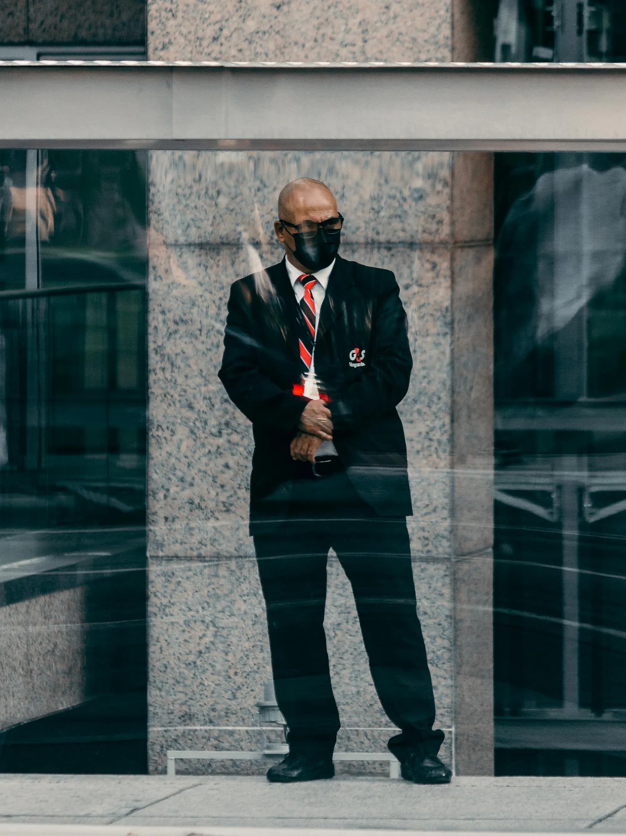 Security professional standing guard